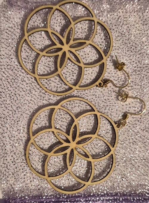 Boucles bois arabesques